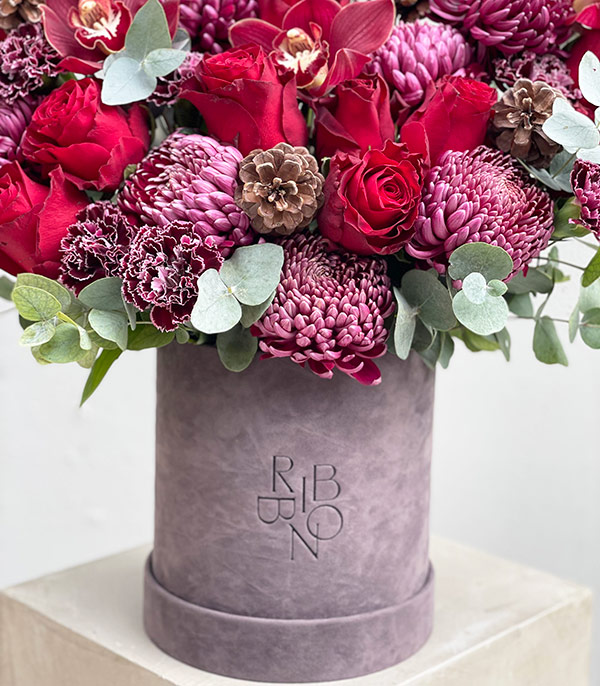 Merry Red Flowers Arrangement in Gray Box
