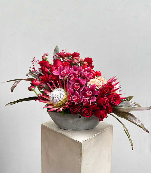 Rocco Deluxe Red Rose Arrangement in Concrete Vase