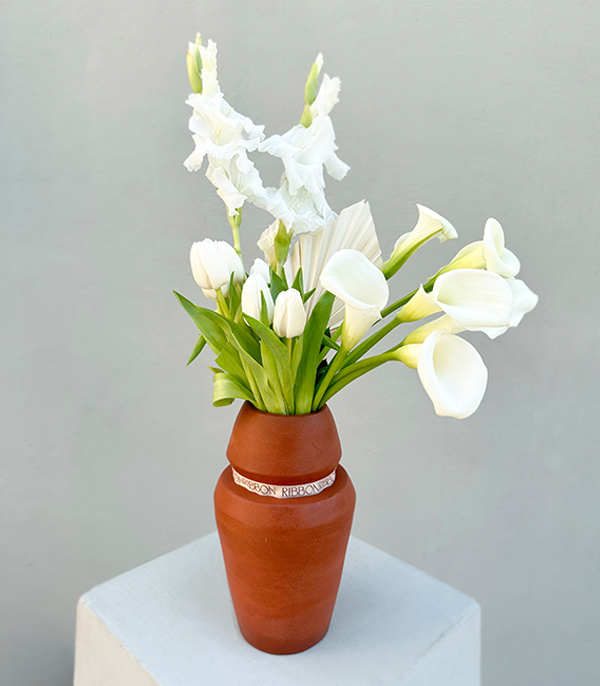 White Flowers in a Handcrafted Ceramic Cube Vase