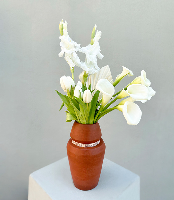 White Flowers in a Handcrafted Ceramic Cube Vase