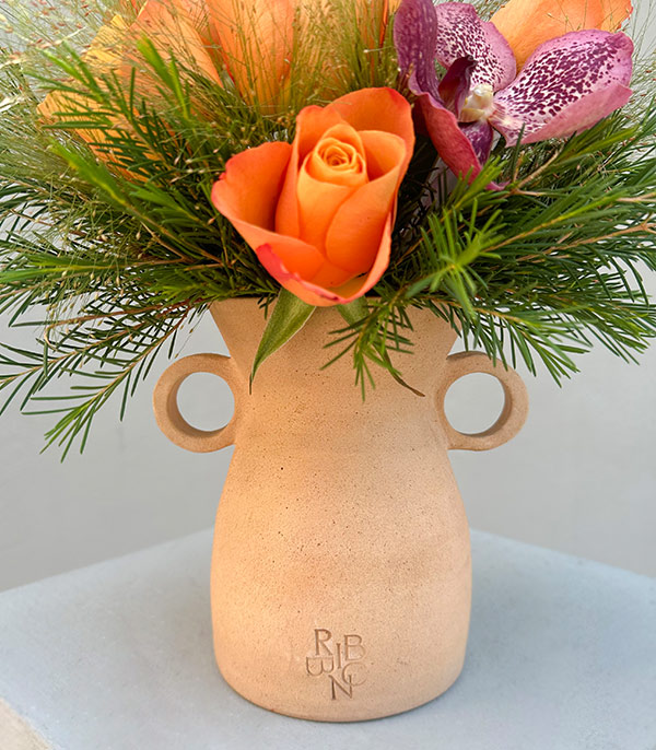 Orange Roses in Two Handled Beige Handcrafted Ceramic Vase