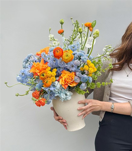 Citrus Deluxe Blue Hydrangea Orange Rose Spring Arrangement in Ceramic Vase
