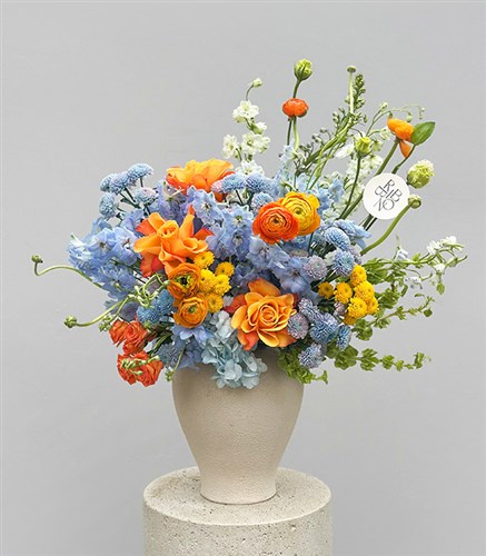 Citrus Deluxe Blue Hydrangea Orange Rose Spring Arrangement in Ceramic Vase