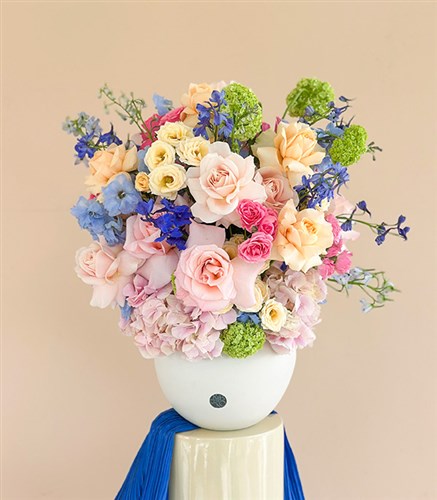 Caresse du Vent Panoramic Pink Blue Spring Flowers in Cream Ceramic Vase