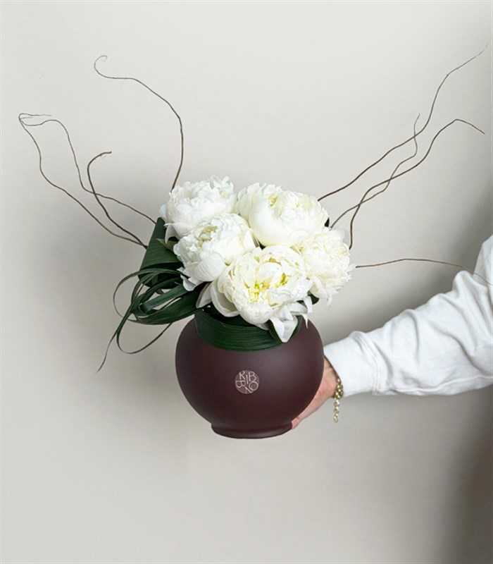 White Peony Arrangement in a Brown Ceramic Vase