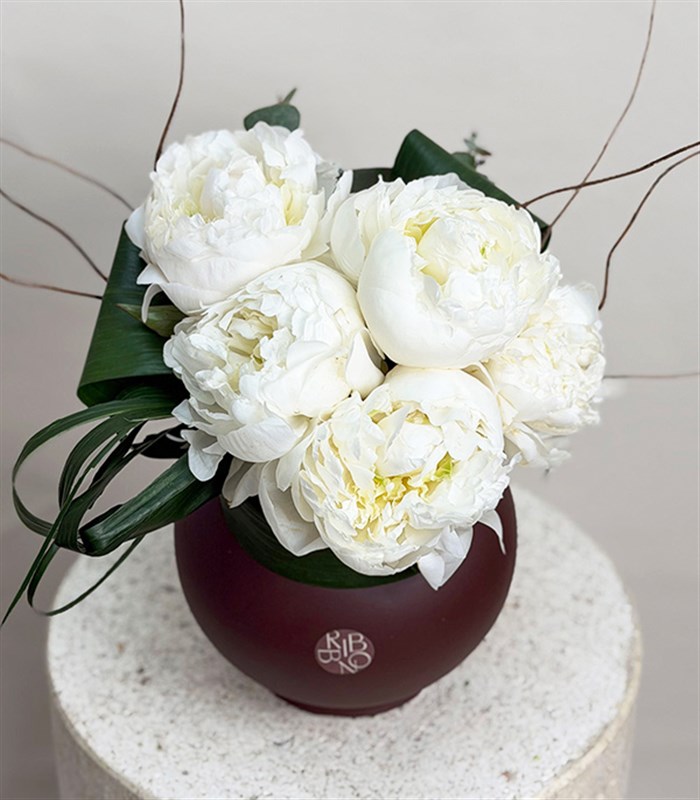 White Peony Arrangement in a Brown Ceramic Vase