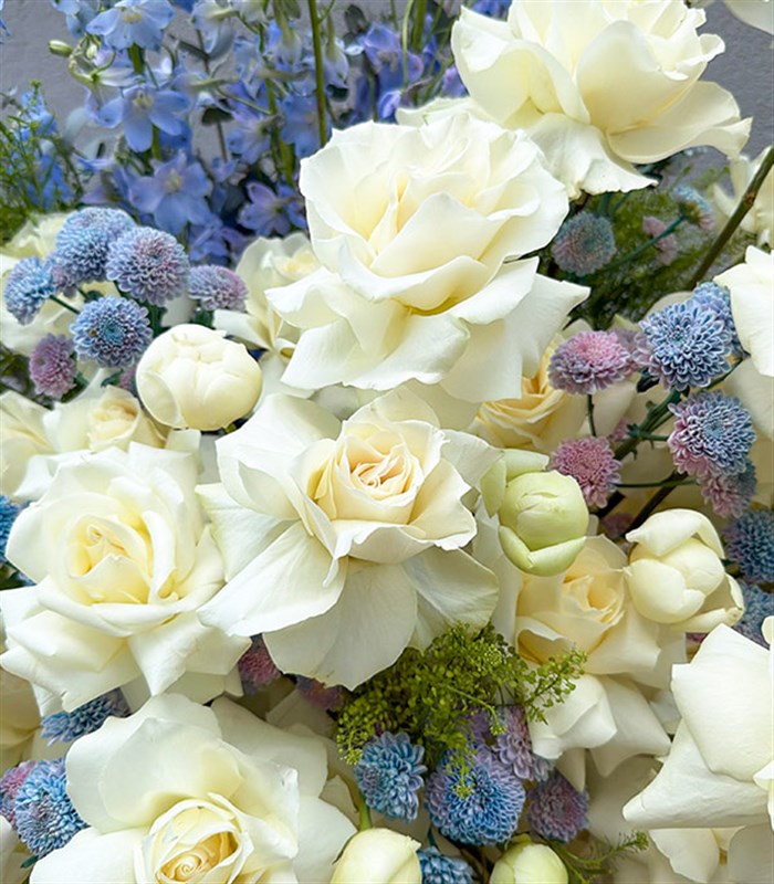 Royal Deluxe Arrangement of White Peonies, Roses, and Blue Delfinyum in a Silver Footed Vase