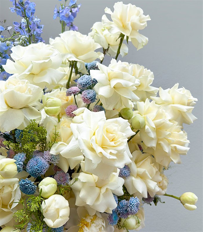 Royal Deluxe Arrangement of White Peonies, Roses, and Blue Delfinyum in a Silver Footed Vase