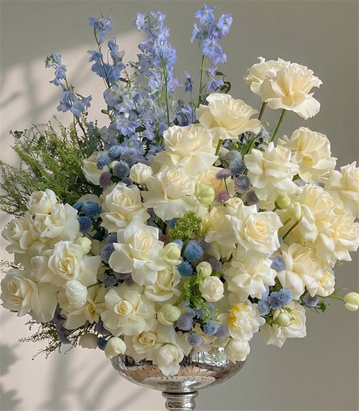 Royal Deluxe Arrangement of White Peonies, Roses, and Blue Delfinyum in a Silver Footed Vase