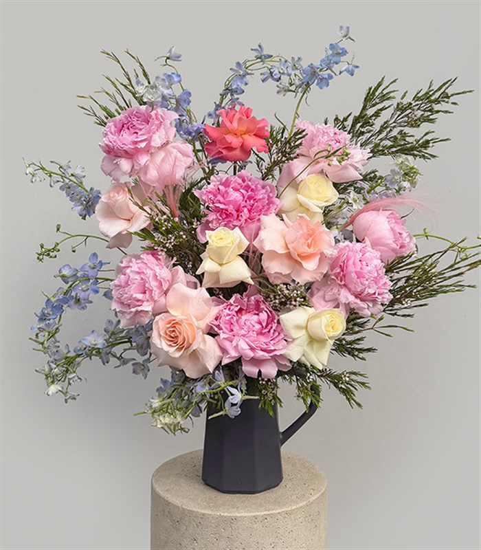 Backyard Beauty Deluxe Arrangement with Peonies in a Ceramic Pitcher and Vase