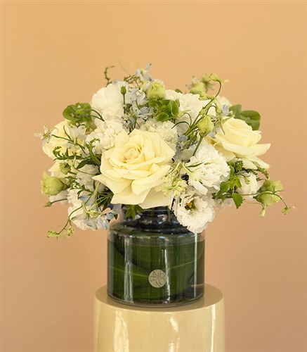 Arrangement of White Roses and Lisianthus in a Veil Glass Vase