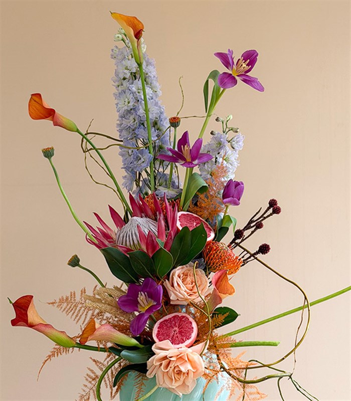 Vittoria Turquoise Vase with Protea and Tulip Exotic Flower Arrangement