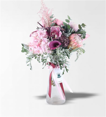 Pink Gala, Protea, Anthurium, and Hydrangeas in a Glass Vase