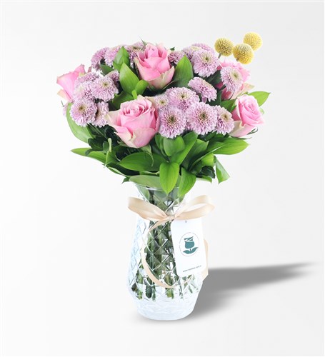 Arrangement of Pink Roses and Pink Daisies in a Glass Vase