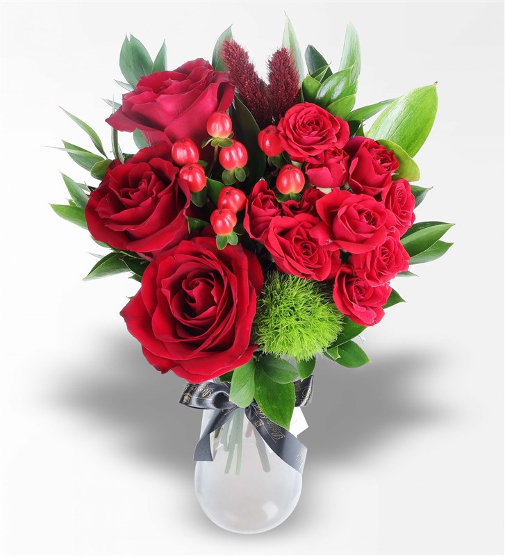 Arrangement of Red Arbor and Ecuadorian Roses in a Black Glass Vase