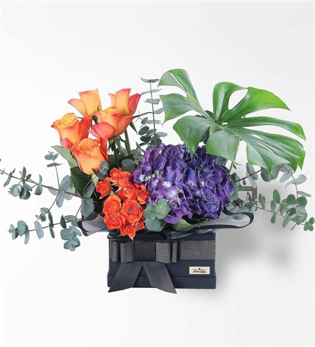 Flower Arrangement in a Black Box with Purple Hydrangeas and Orange Roses (XL)