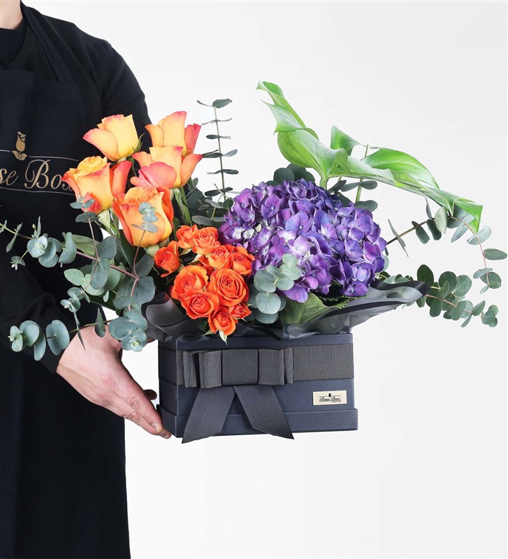Flower Arrangement in a Black Box with Purple Hydrangeas and Orange Roses (XL)