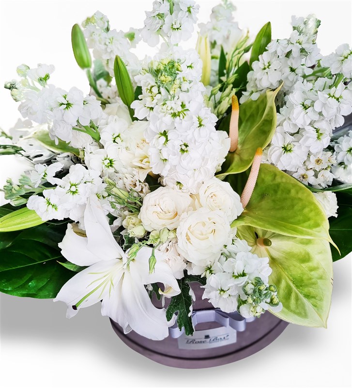 Arrangement of Wallflowers, Lilies, Lisianthus, and Anthuriums in a Large Grey Velvet Box