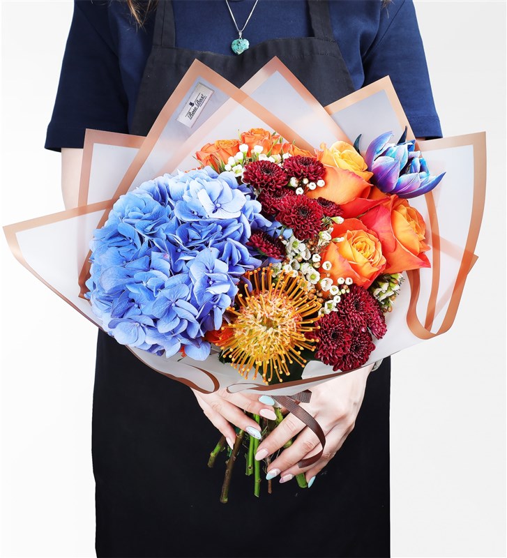 Wild Bloom Bouquet - Blue Hydrangea, Lecuspermum, Orange Ecuadorian Roses, Galaxy Tulip and Prupetta Red Santini