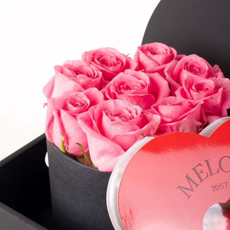 Pink Roses, Teddy Bear, and Heart-Shaped Chocolates on a Spoiled Wooden Tray